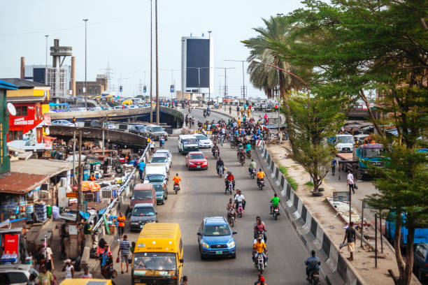 African city traffic - Lagos, Nigeria Traffic in african megacity. Lagos, Nigeria, West Africa package delivery in nigeria stock pictures, royalty-free photos & images