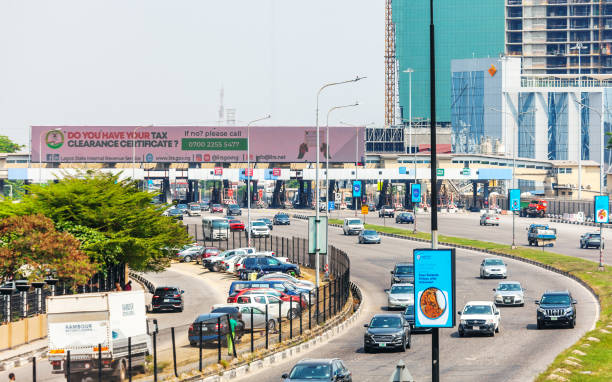 Lekki Toll Gate - Lagos, Nigeria Lagos, Nigeria - City traffic heading to the Lekki Toll Gate delivery van in nigeria stock pictures, royalty-free photos & images